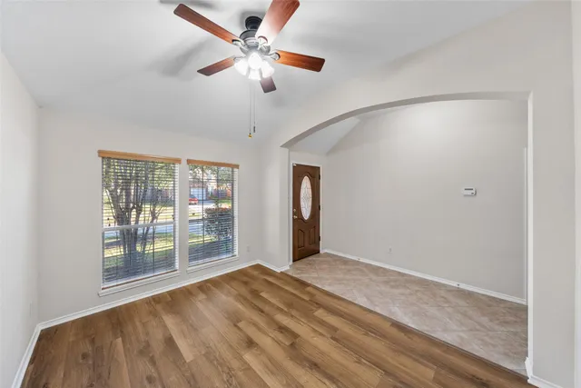 a view of an empty room with a window