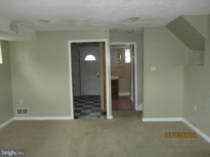 5803 Channing Road Springfield, VA 22150 - Photo 11 of 12 an empty room with an entryway