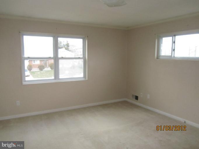 5803 Channing Road Springfield, VA 22150 - Photo 5 of 12 an empty room with a window
