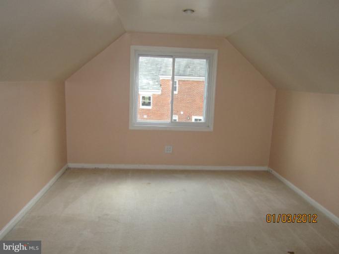 5803 Channing Road Springfield, VA 22150 - Photo 7 of 12 an empty room with a window