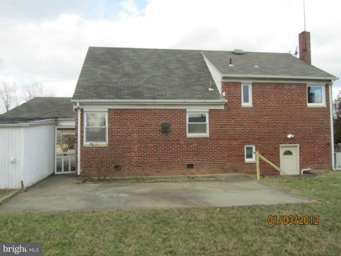 5803 Channing Road Springfield, VA 22150 - Photo 9 of 12 front view of a house with a yard