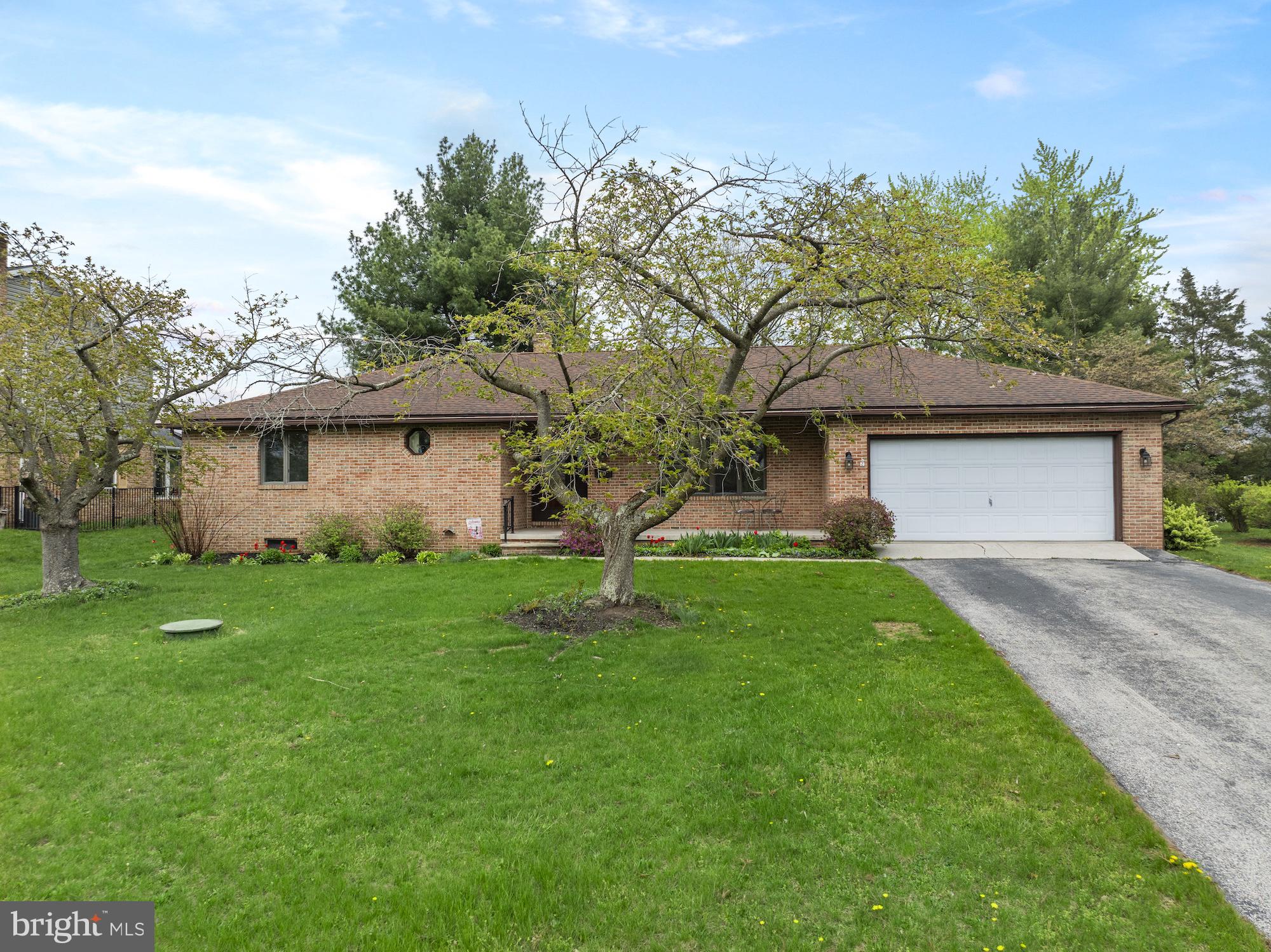 617 Heritage Drive Gettysburg, PA 17325 - Photo 12 of 56 a front view of a house with a garden