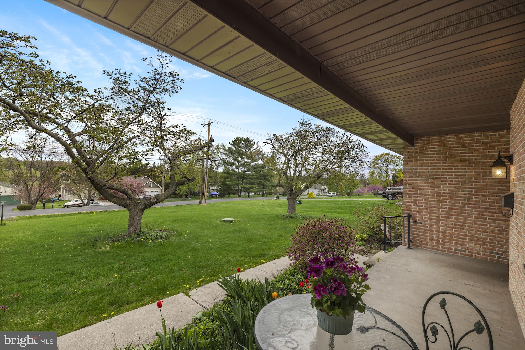 617 Heritage Drive Gettysburg, PA 17325 - Photo 2 of 56 a view of a garden with plants and a fountain