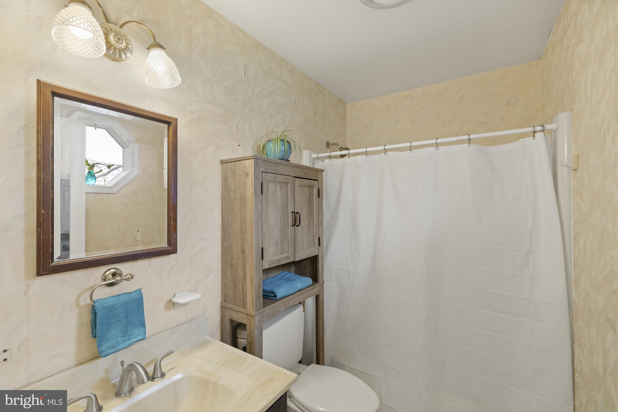 617 Heritage Drive Gettysburg, PA 17325 - Photo 24 of 56 a bathroom with a sink toilet and vanity