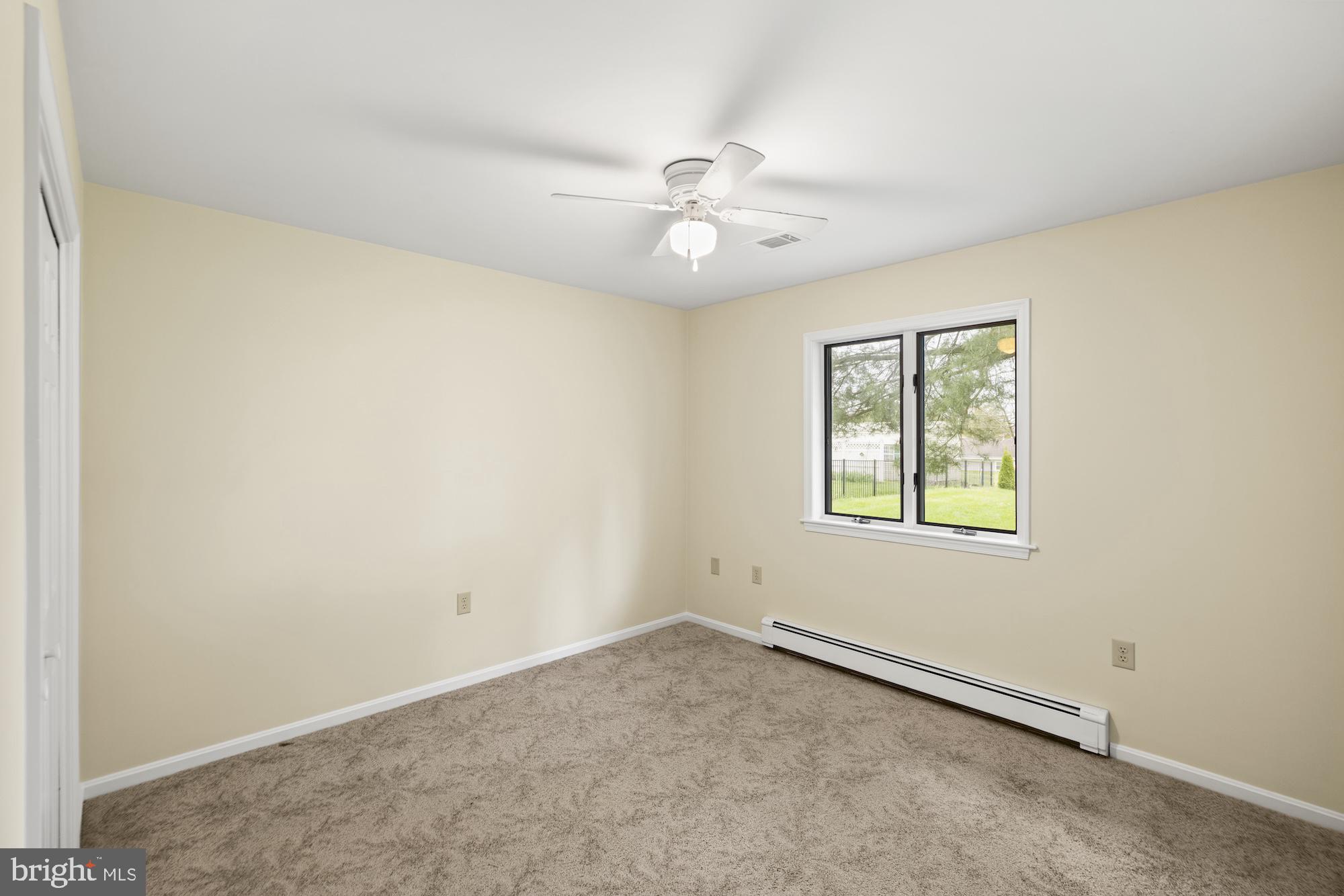 617 Heritage Drive Gettysburg, PA 17325 - Photo 29 of 56 an empty room with a window and ceiling fan
