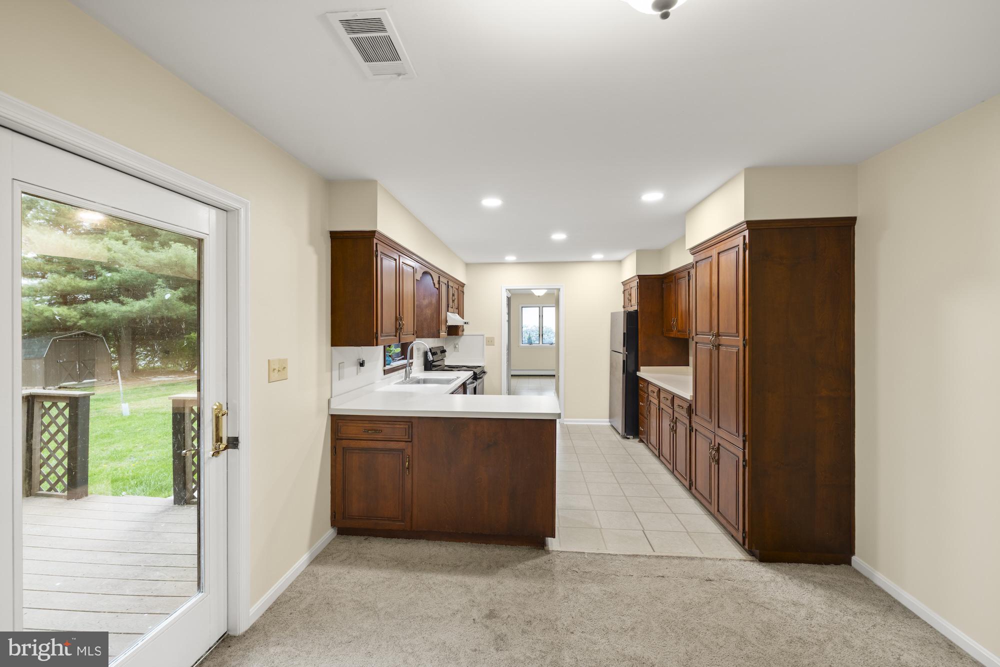 617 Heritage Drive Gettysburg, PA 17325 - Photo 10 of 56 a view of kitchen with stainless steel appliances kitchen island granite countertop a refrigerator and a sink