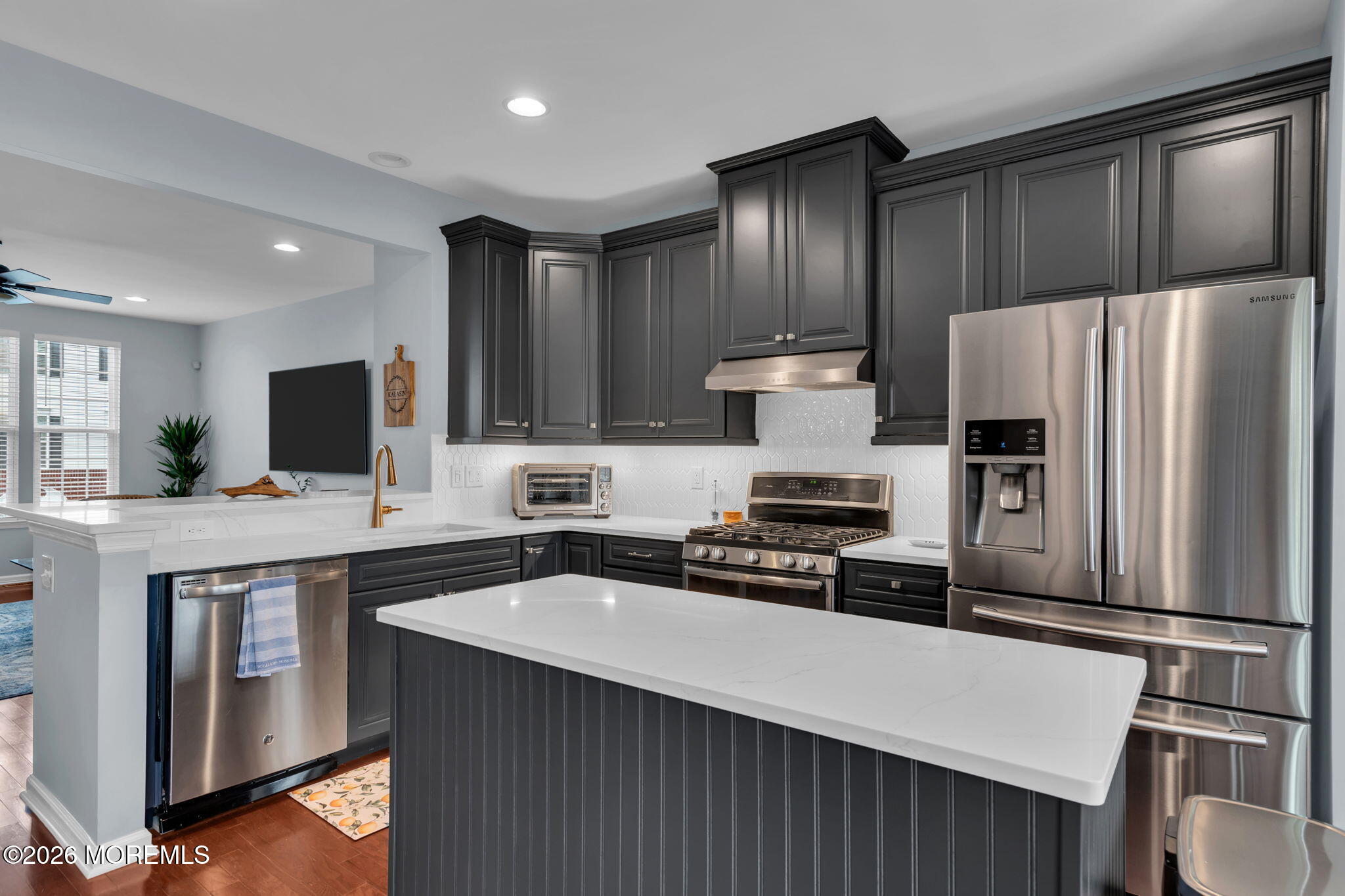 101 Spirit Way, Unit 301 Brick, NJ 08723 - Photo 2 of 52 a kitchen with stainless steel appliances a refrigerator stove microwave and sink