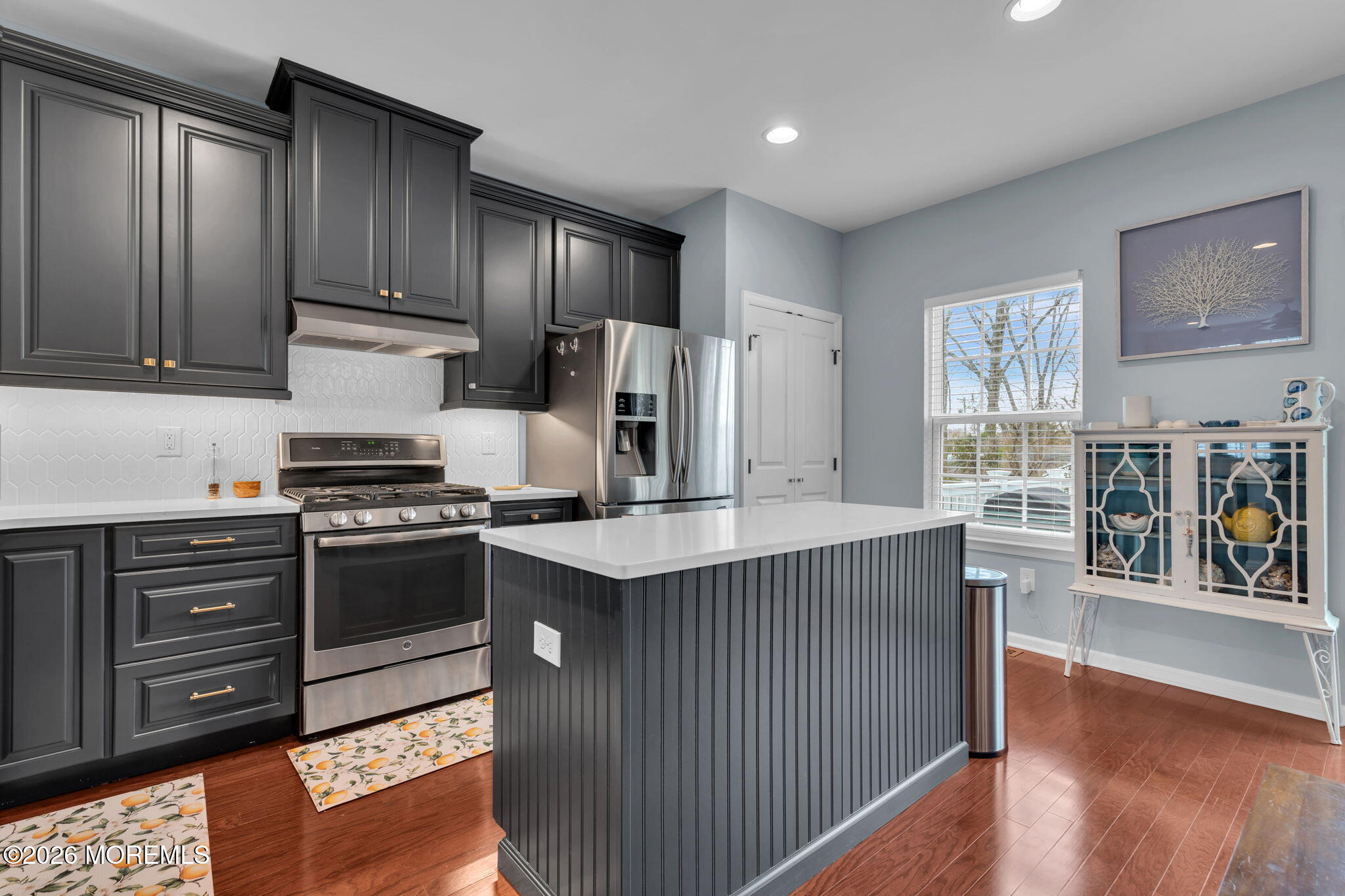 101 Spirit Way, Unit 301 Brick, NJ 08723 - Photo 22 of 52 a kitchen with stainless steel appliances granite countertop a stove a sink dishwasher and a refrigerator with wooden floor