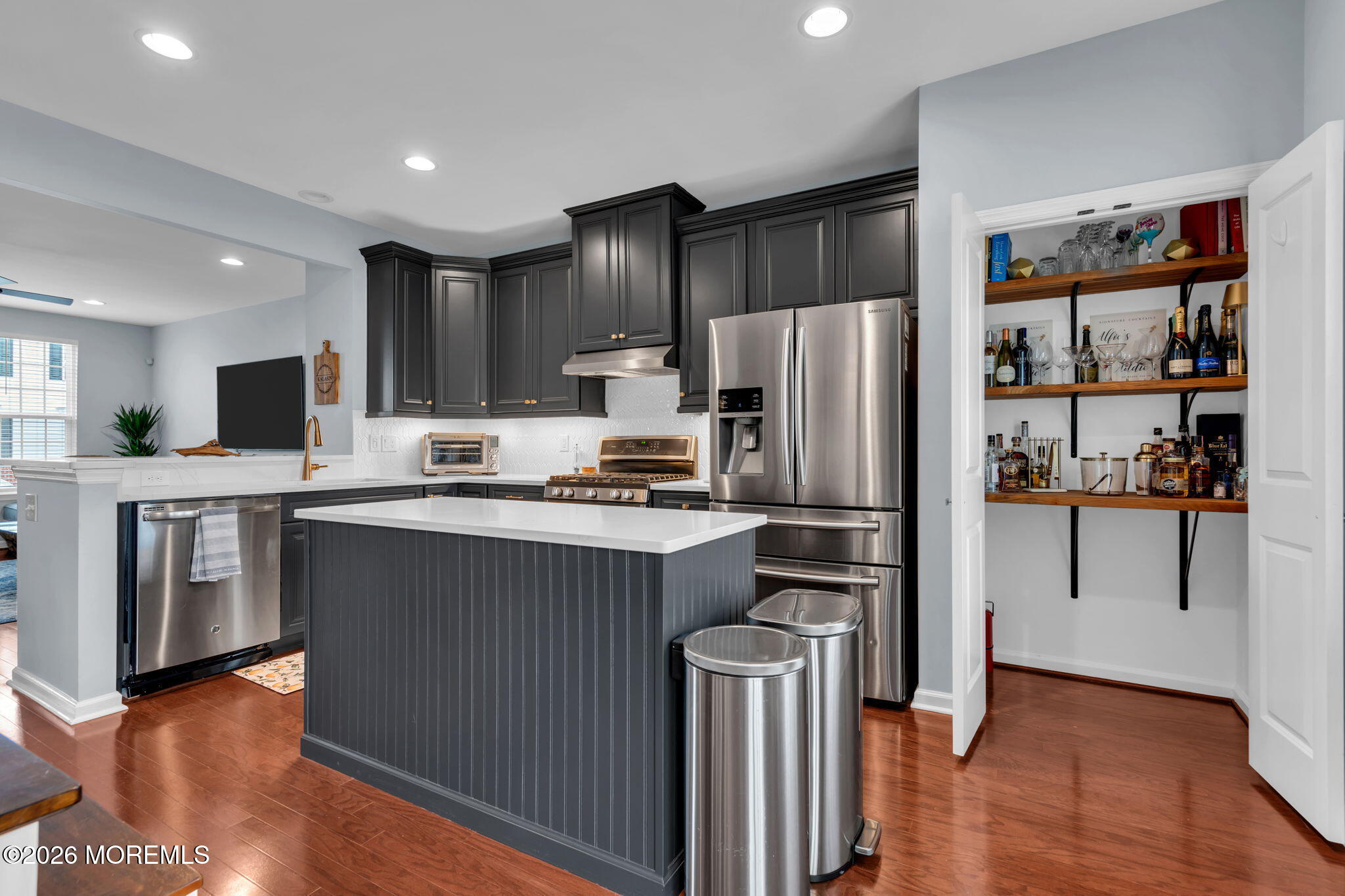 101 Spirit Way, Unit 301 Brick, NJ 08723 - Photo 24 of 52 a kitchen with stainless steel appliances a refrigerator and a stove top oven