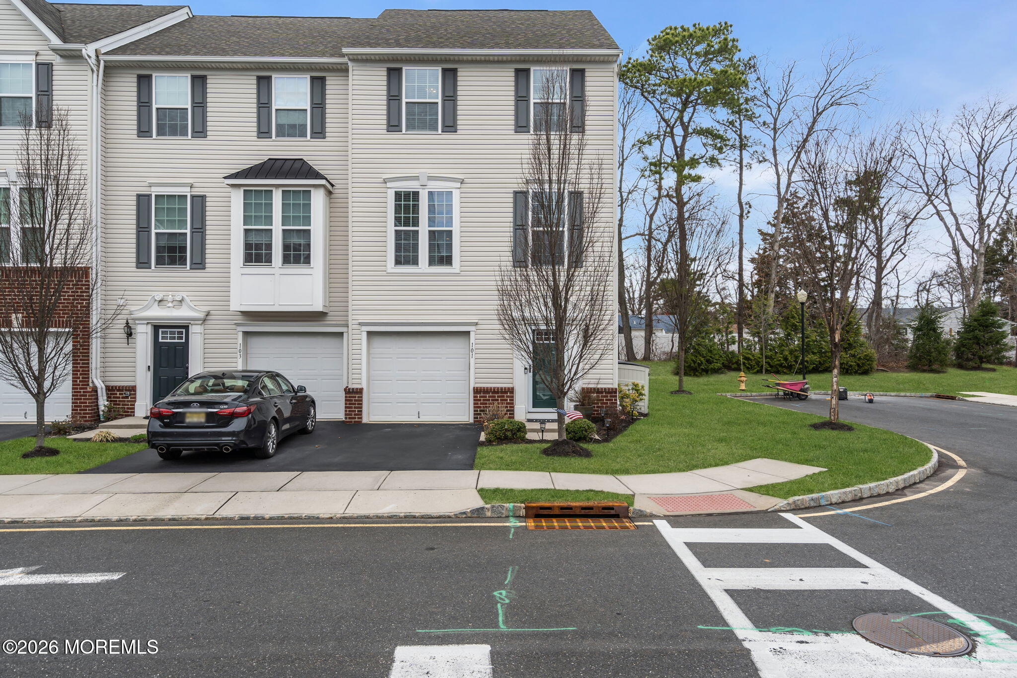 101 Spirit Way, Unit 301 Brick, NJ 08723 - Photo 35 of 52 a car parked in front of a brick house