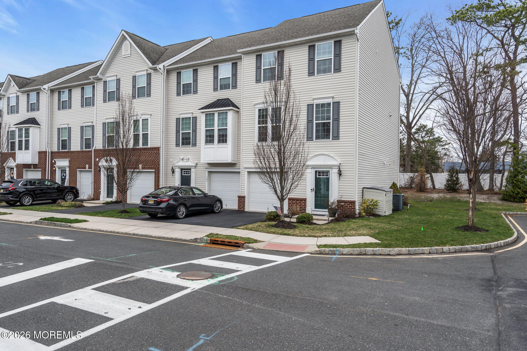 101 Spirit Way, Unit 301 Brick, NJ 08723 - Photo 49 of 52 a view of a parked cars in front of a building