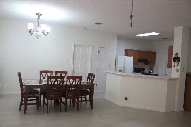 a view of a dining room with furniture