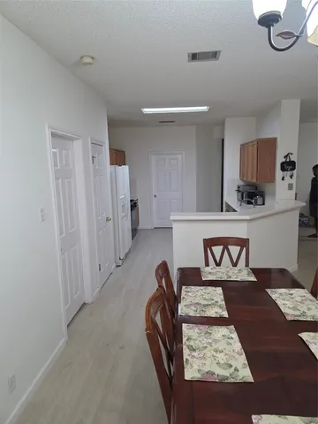 a kitchen with a sink a stove and a refrigerator