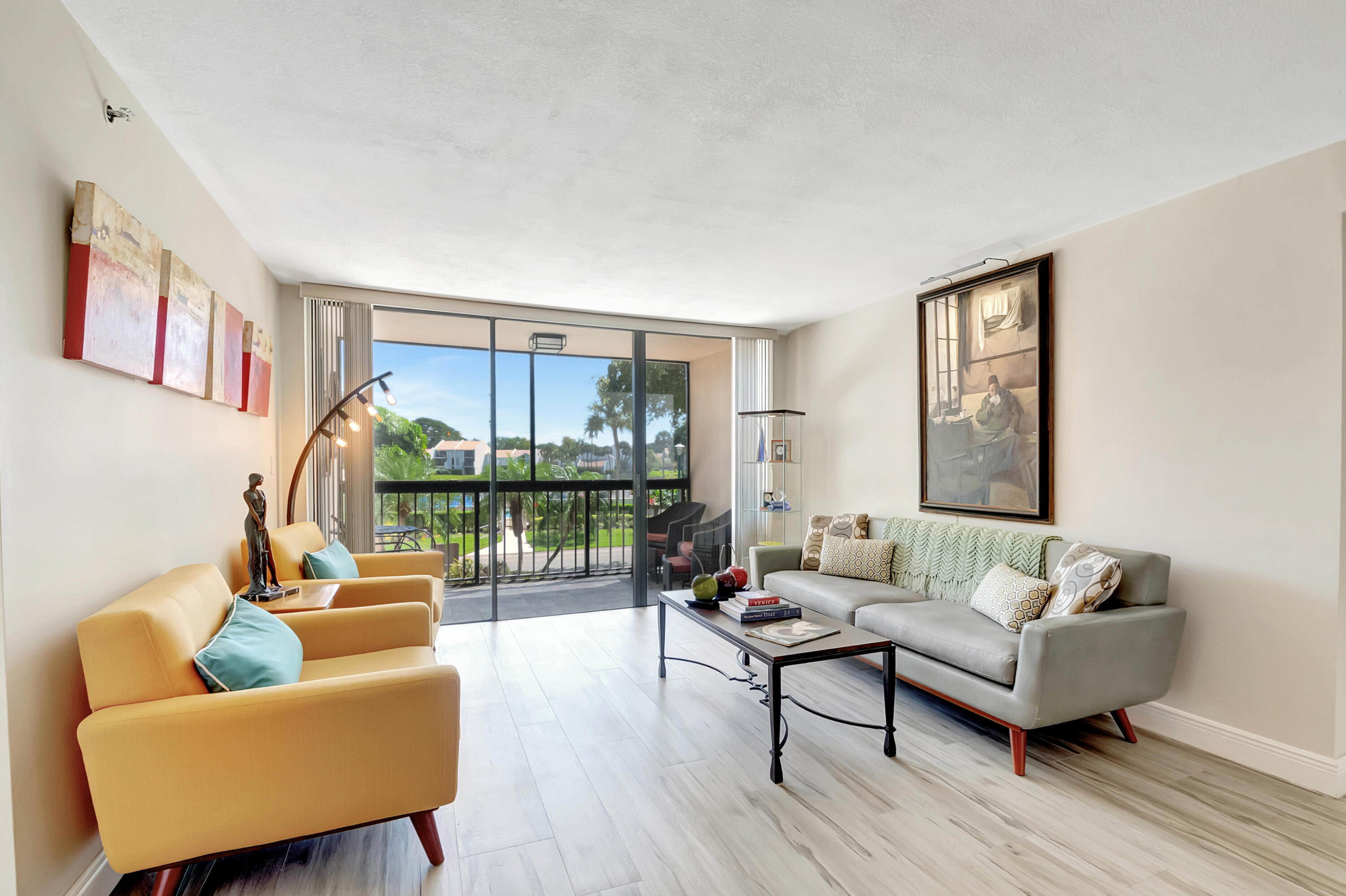 1523 Bridgewood Drive Boca Raton, FL 33434 - Photo 1 of 50 a living room with furniture and a large window