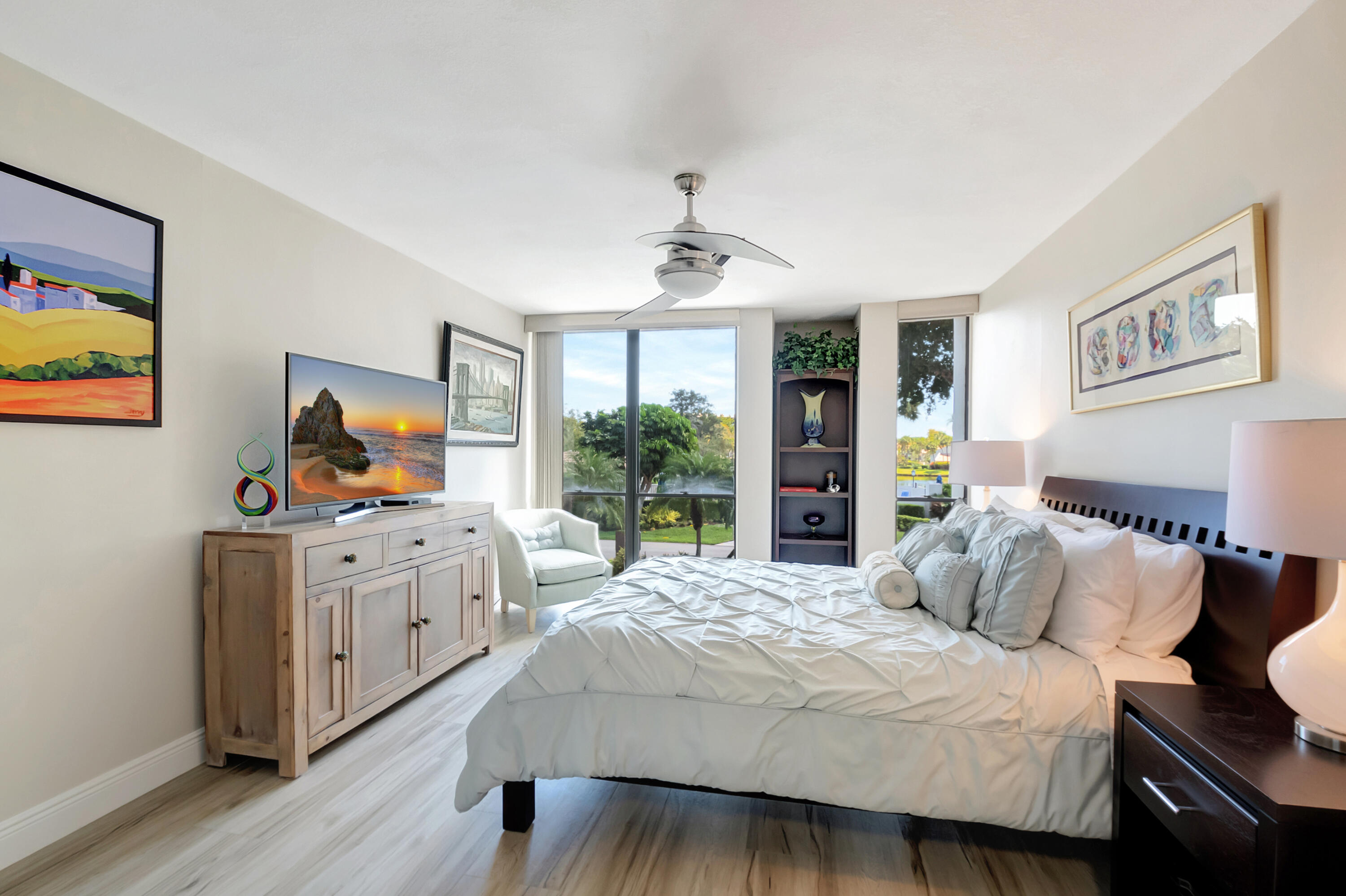 1523 Bridgewood Drive Boca Raton, FL 33434 - Photo 13 of 50 a bedroom with a bed and wooden floor