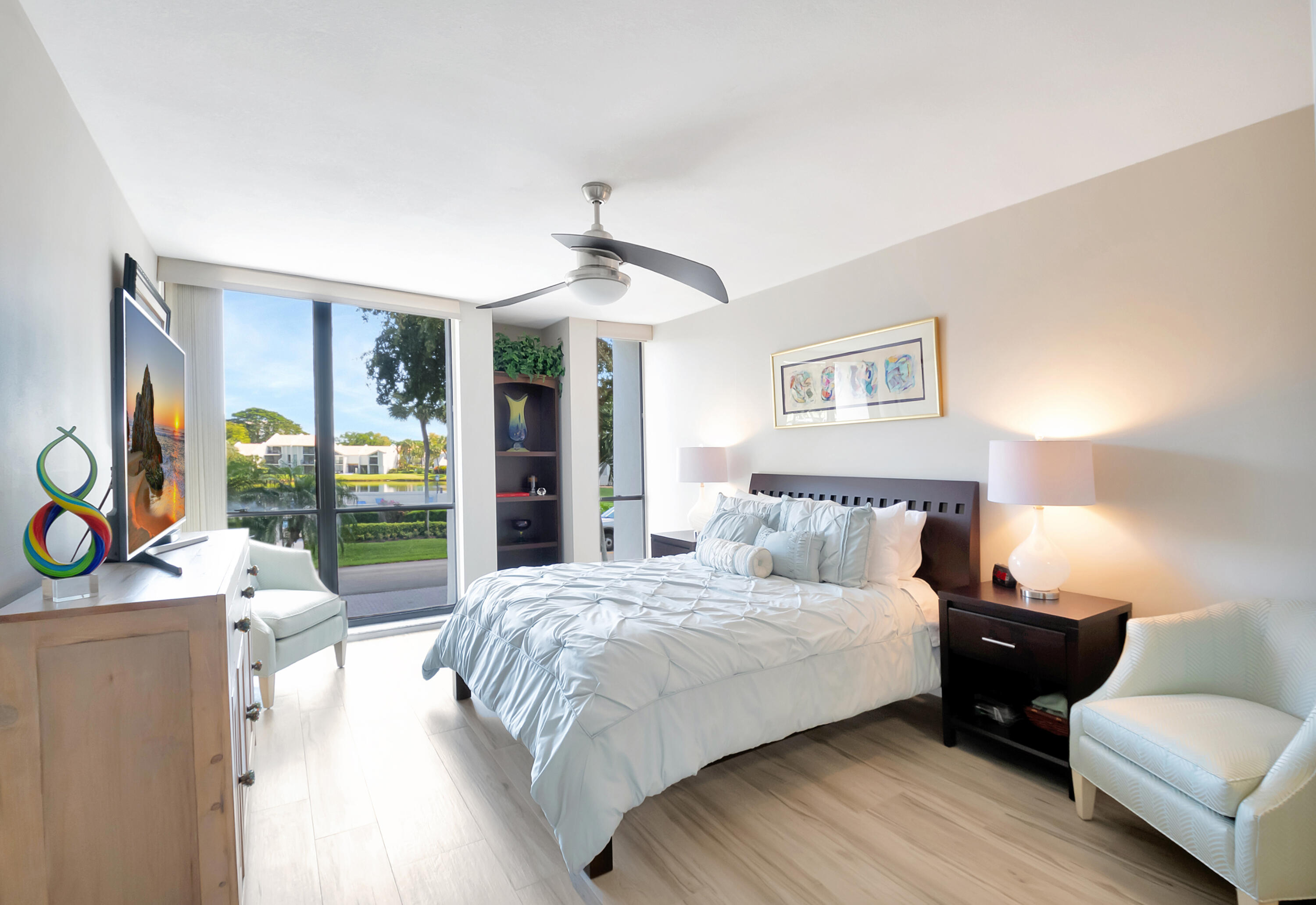 1523 Bridgewood Drive Boca Raton, FL 33434 - Photo 2 of 50 a bedroom with a bed and a couch