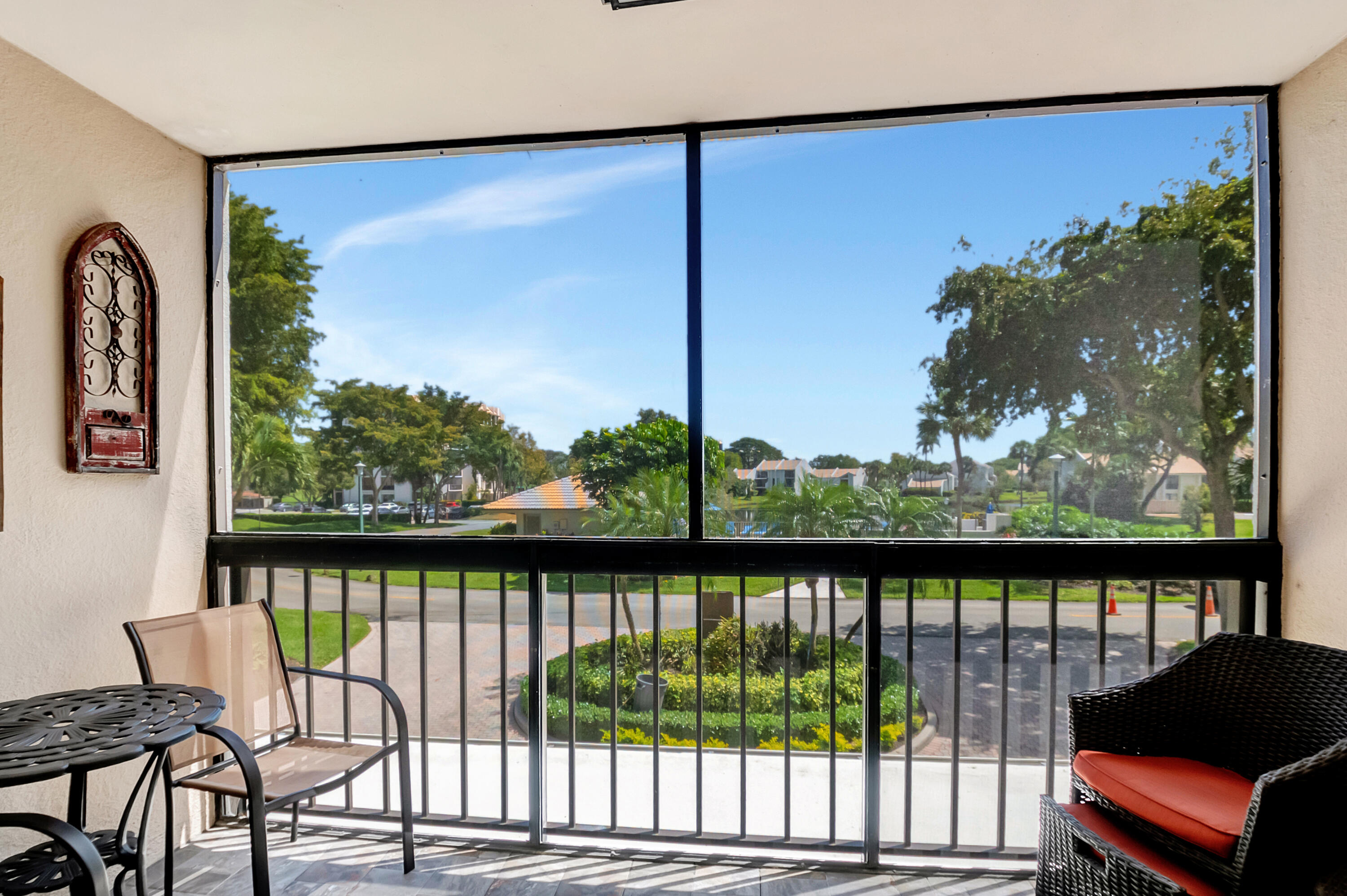 1523 Bridgewood Drive Boca Raton, FL 33434 - Photo 21 of 50 a view of a lake from a balcony