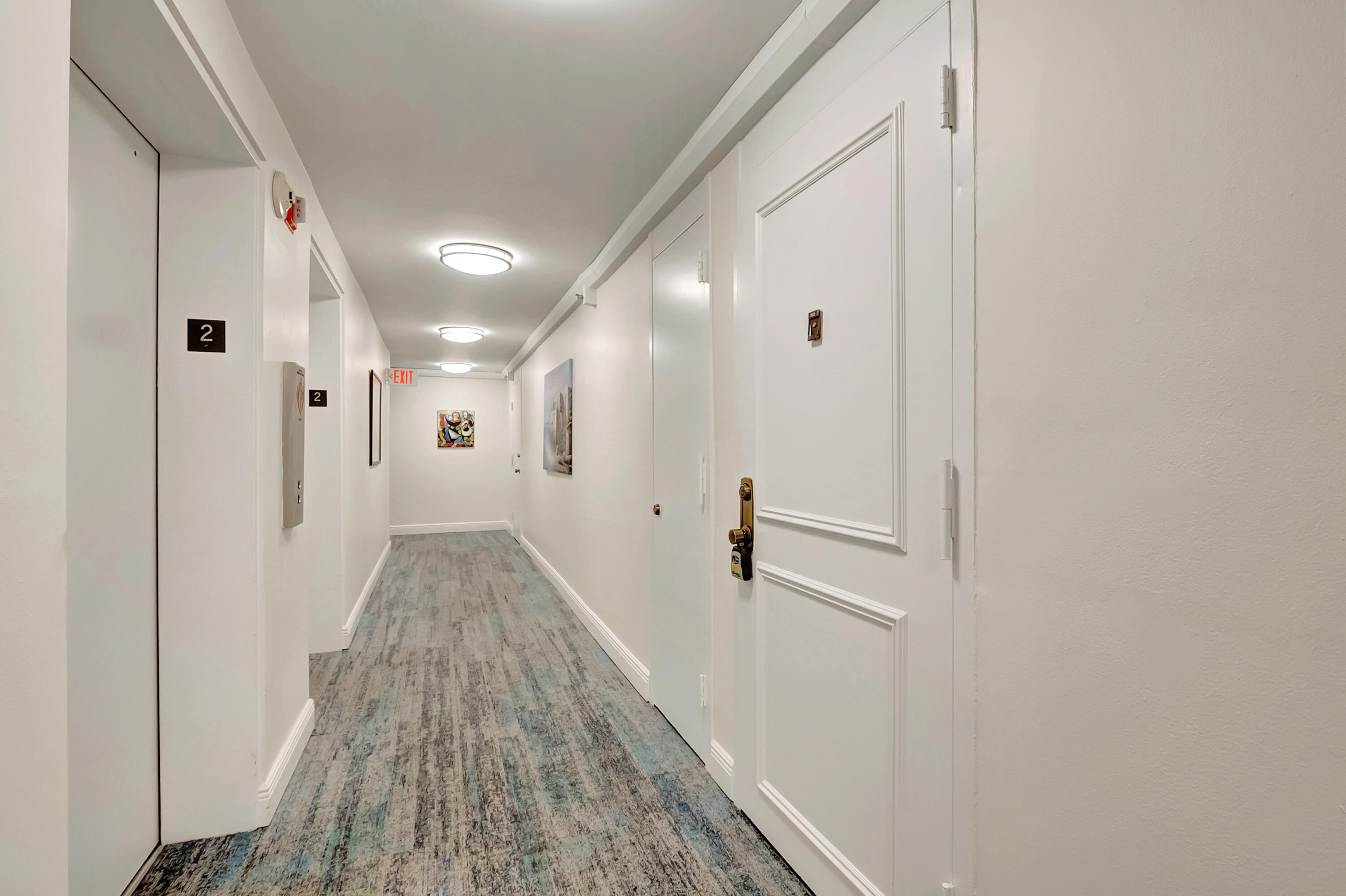 1523 Bridgewood Drive Boca Raton, FL 33434 - Photo 24 of 50 a view of a hallway with white walls