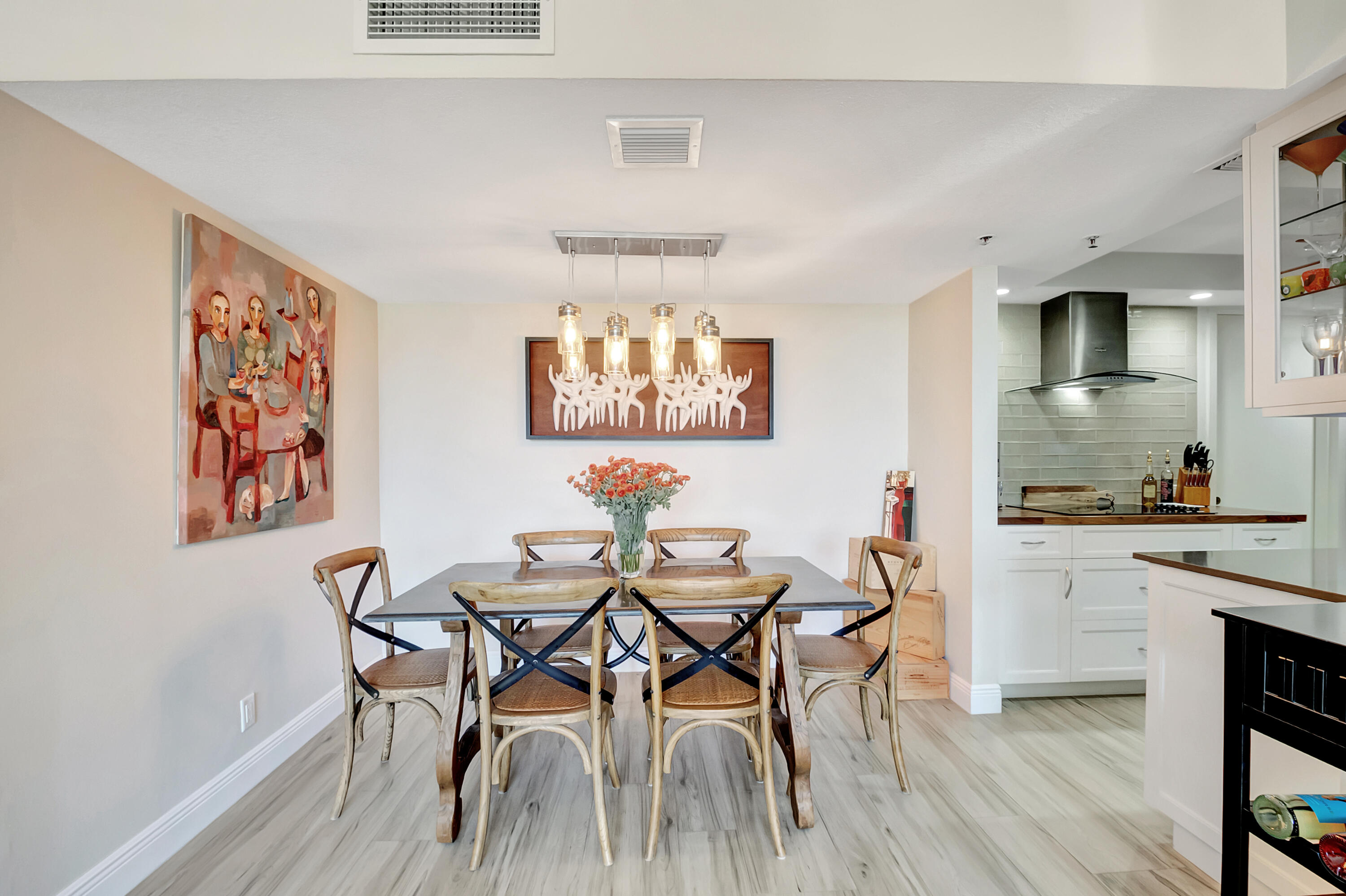 1523 Bridgewood Drive Boca Raton, FL 33434 - Photo 5 of 50 a view of a dining room with furniture and wooden floor