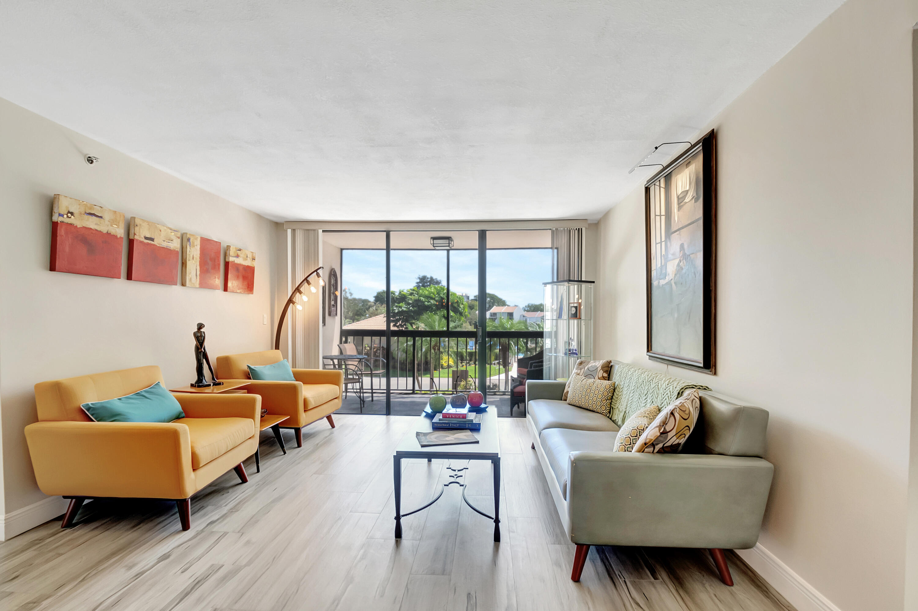 1523 Bridgewood Drive Boca Raton, FL 33434 - Photo 9 of 50 a living room with furniture and a potted plant