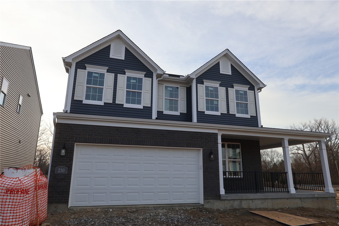 230 Tilly Court, Unit 4 Springboro, OH 45066 - Photo 6 of 20 This newly constructed home features a welcoming porch, a spacious garage, and contemporary design elements.