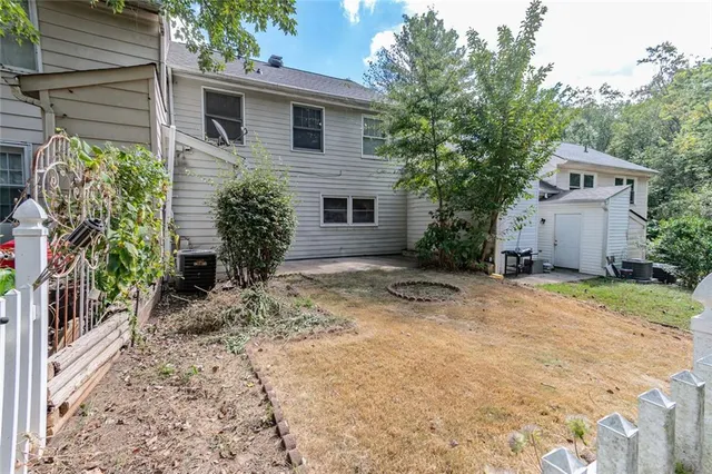 a view of a house with a yard and plants