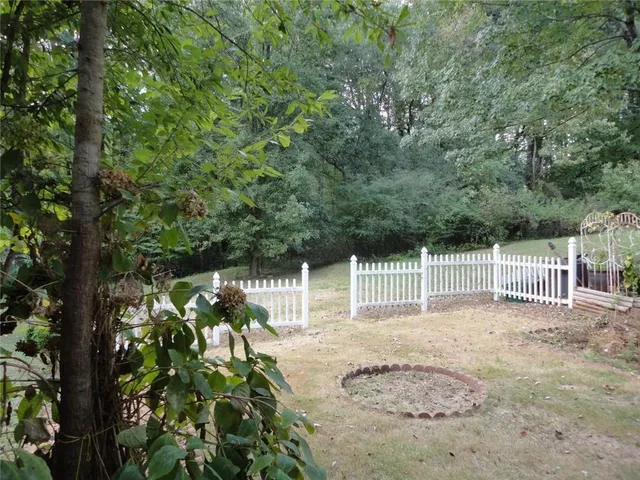 a backyard of a house with lots of green space