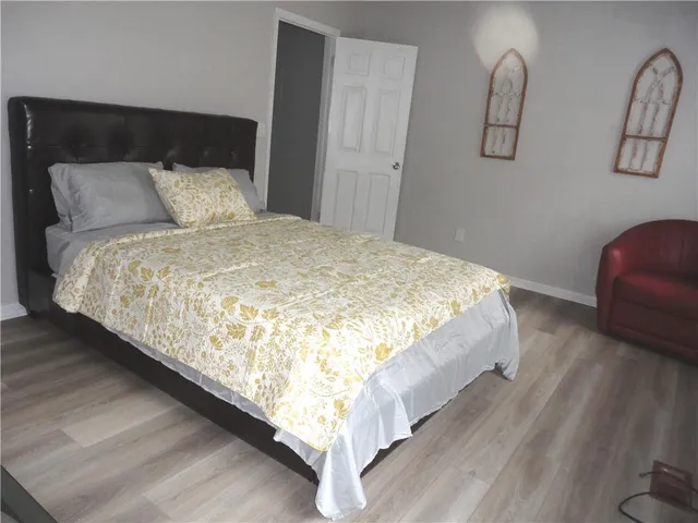 a bedroom with bed and window