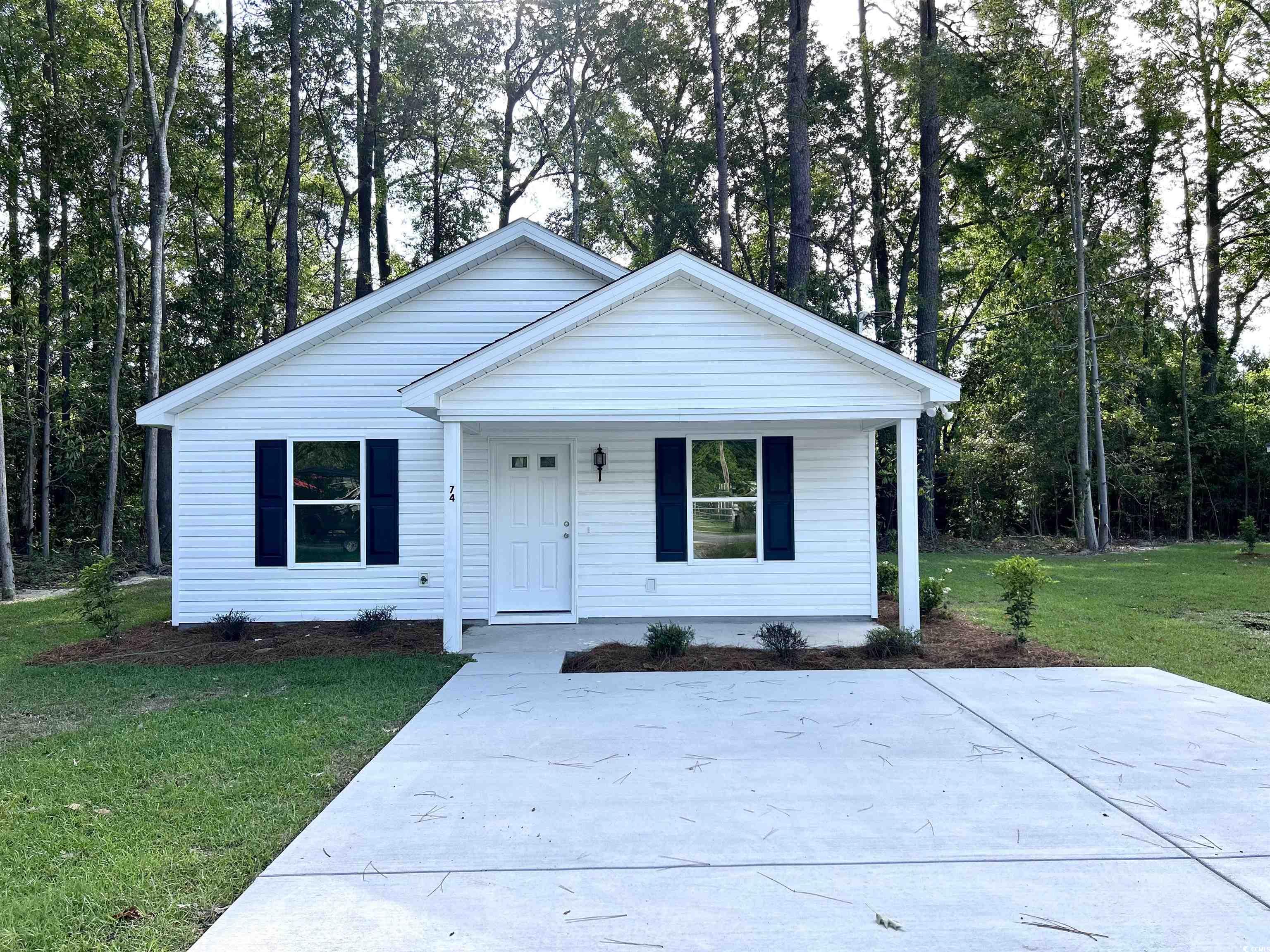 74 Greentown Road Georgetown, SC 29440 - Photo 1 of 17 View of front facade featuring a porch and a front