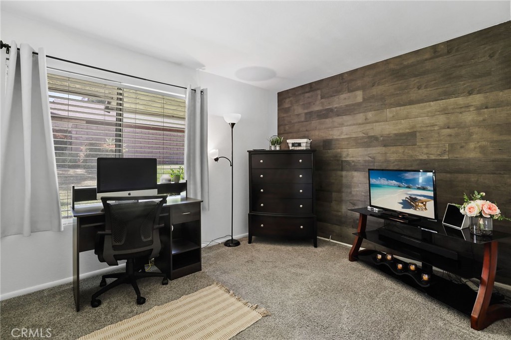 916 Ardmore Circle Redlands, CA 92374 - Photo 19 of 29 a room with furniture and a flat screen tv