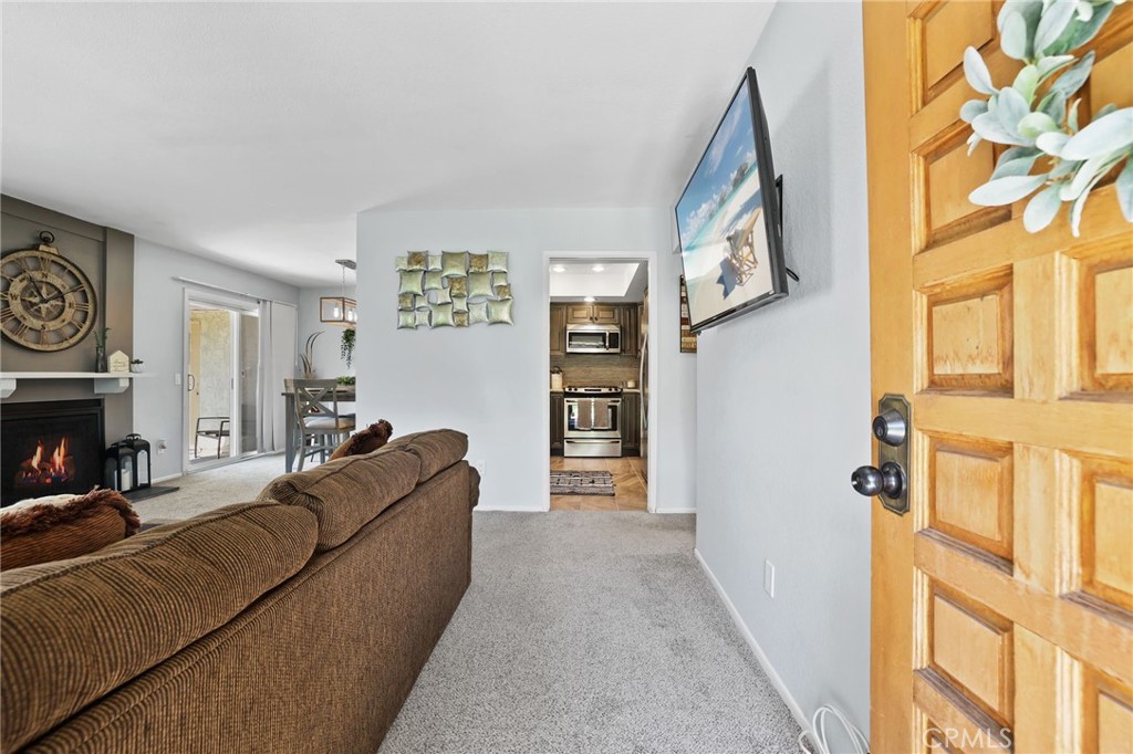 916 Ardmore Circle Redlands, CA 92374 - Photo 2 of 29 a living room with furniture and a fireplace