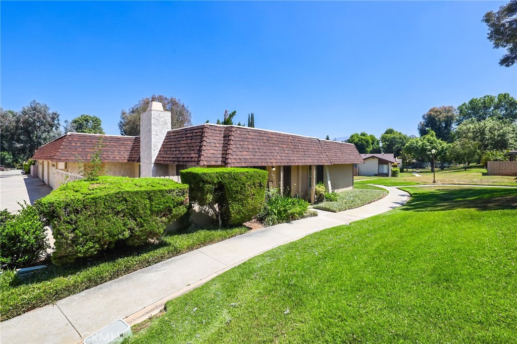 916 Ardmore Circle Redlands, CA 92374 - Photo 25 of 29 a front view of a house with a yard
