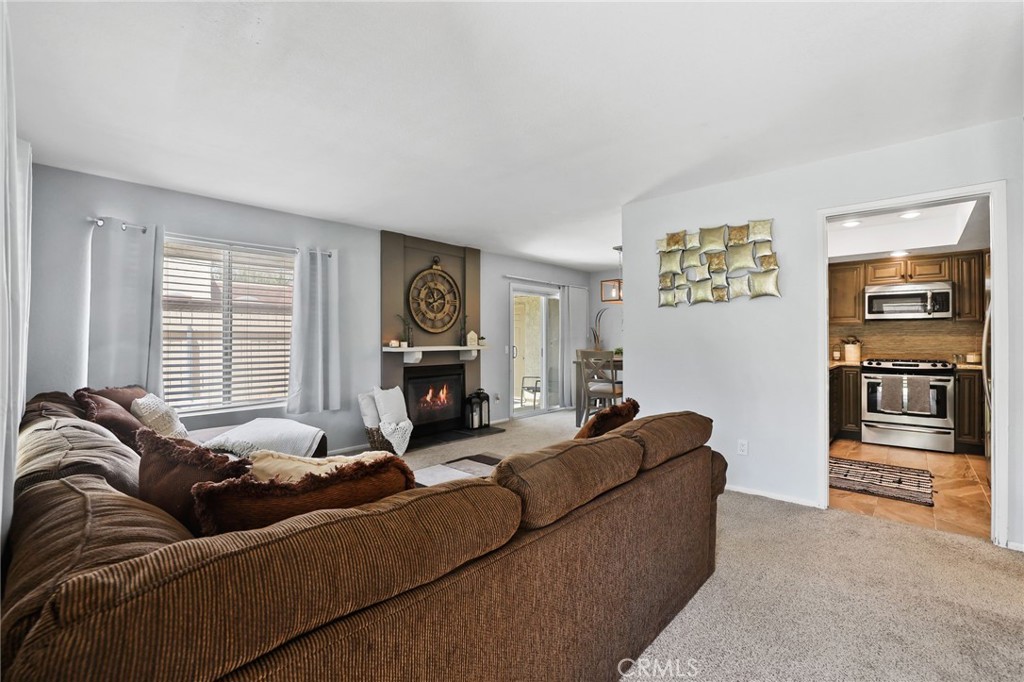 916 Ardmore Circle Redlands, CA 92374 - Photo 3 of 29 a living room with furniture and a window