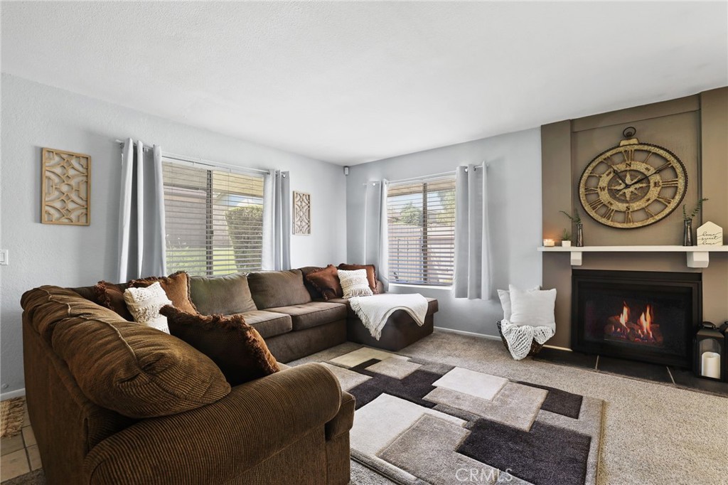 916 Ardmore Circle Redlands, CA 92374 - Photo 4 of 29 a living room with furniture and a fireplace