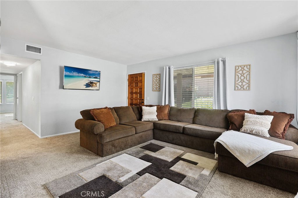 916 Ardmore Circle Redlands, CA 92374 - Photo 5 of 29 a living room with furniture and a large window