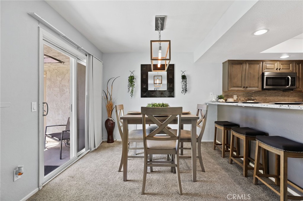 916 Ardmore Circle Redlands, CA 92374 - Photo 7 of 29 a view of a dining room with furniture