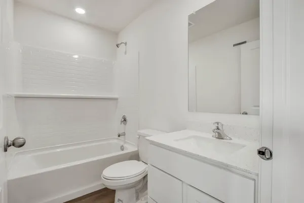 a bathroom with a sink a toilet and a bathtub