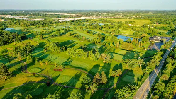 an aerial view of residential houses with outdoor space