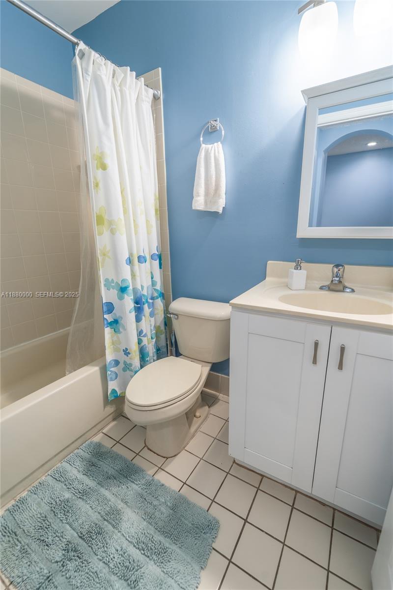 983 Northeast 42nd Place Homestead, FL 33033 - Photo 13 of 51 a bathroom with a sink a toilet and shower
