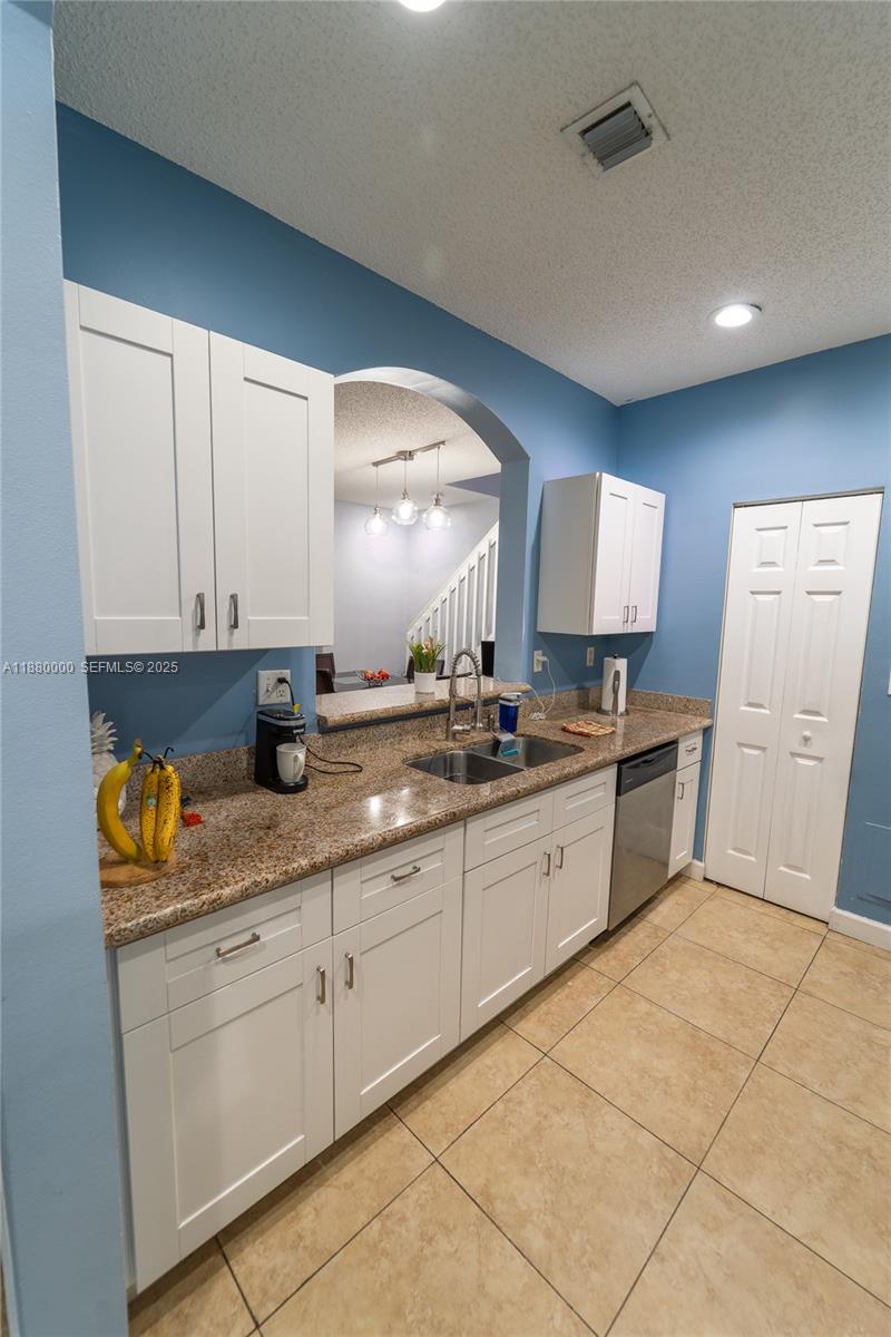 983 Northeast 42nd Place Homestead, FL 33033 - Photo 24 of 51 a large bathroom with a sink and a mirror