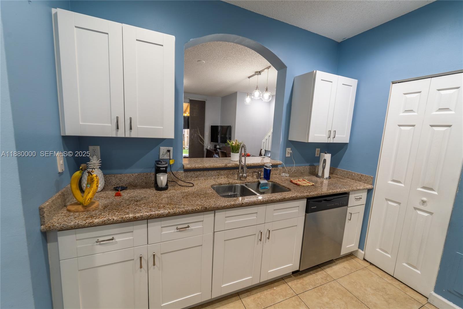 983 Northeast 42nd Place Homestead, FL 33033 - Photo 25 of 51 a bathroom with a granite countertop double vanity sink and mirror