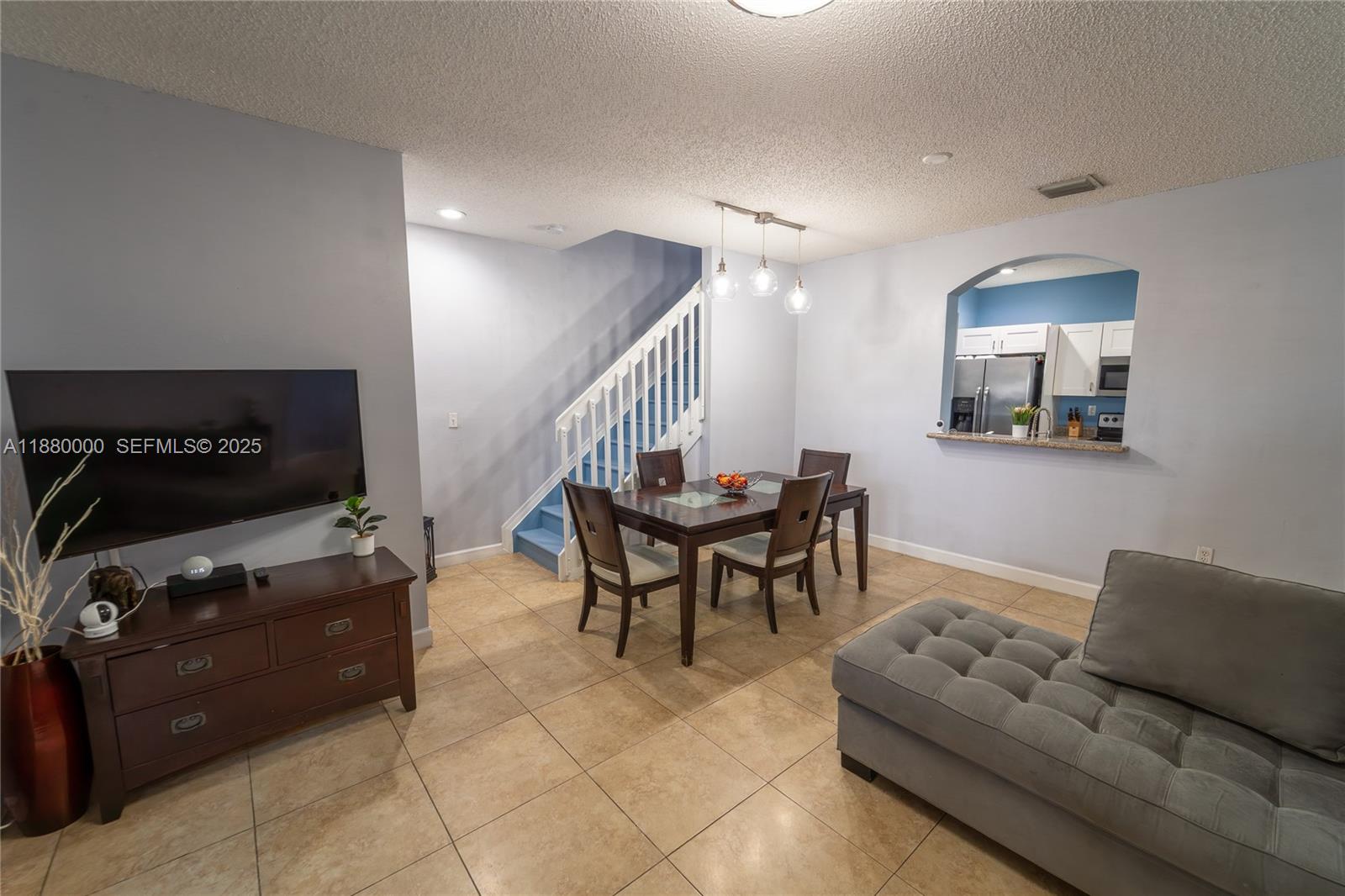 983 Northeast 42nd Place Homestead, FL 33033 - Photo 28 of 51 a living room with furniture and a flat screen tv
