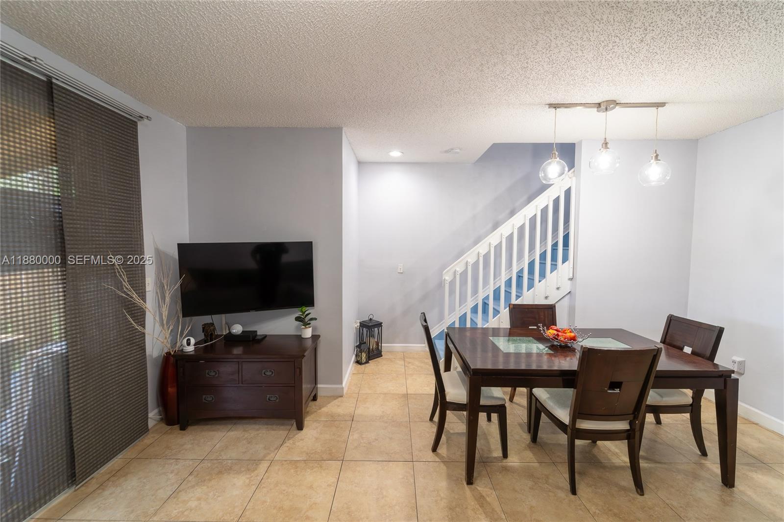 983 Northeast 42nd Place Homestead, FL 33033 - Photo 35 of 51 a view of a livingroom with furniture and a flat screen tv
