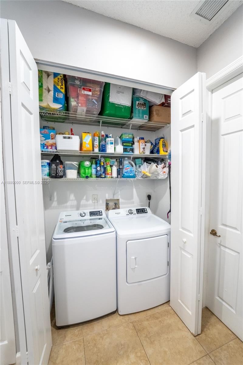 983 Northeast 42nd Place Homestead, FL 33033 - Photo 36 of 51 a view of washer and dryer in a utility room