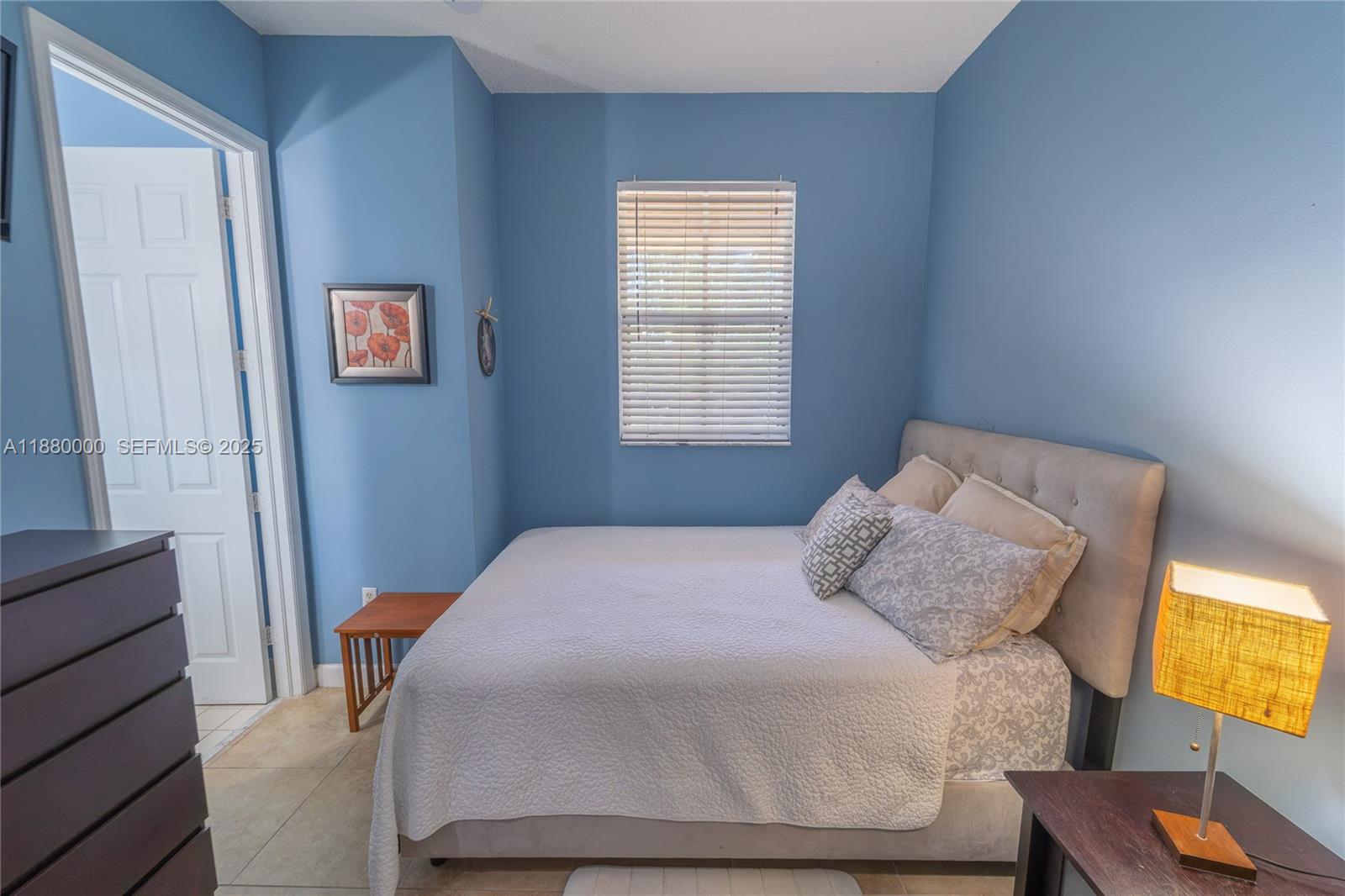983 Northeast 42nd Place Homestead, FL 33033 - Photo 39 of 51 a bedroom with a bed and window