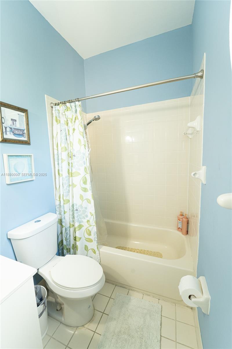 983 Northeast 42nd Place Homestead, FL 33033 - Photo 40 of 51 a bathroom with a toilet and shower