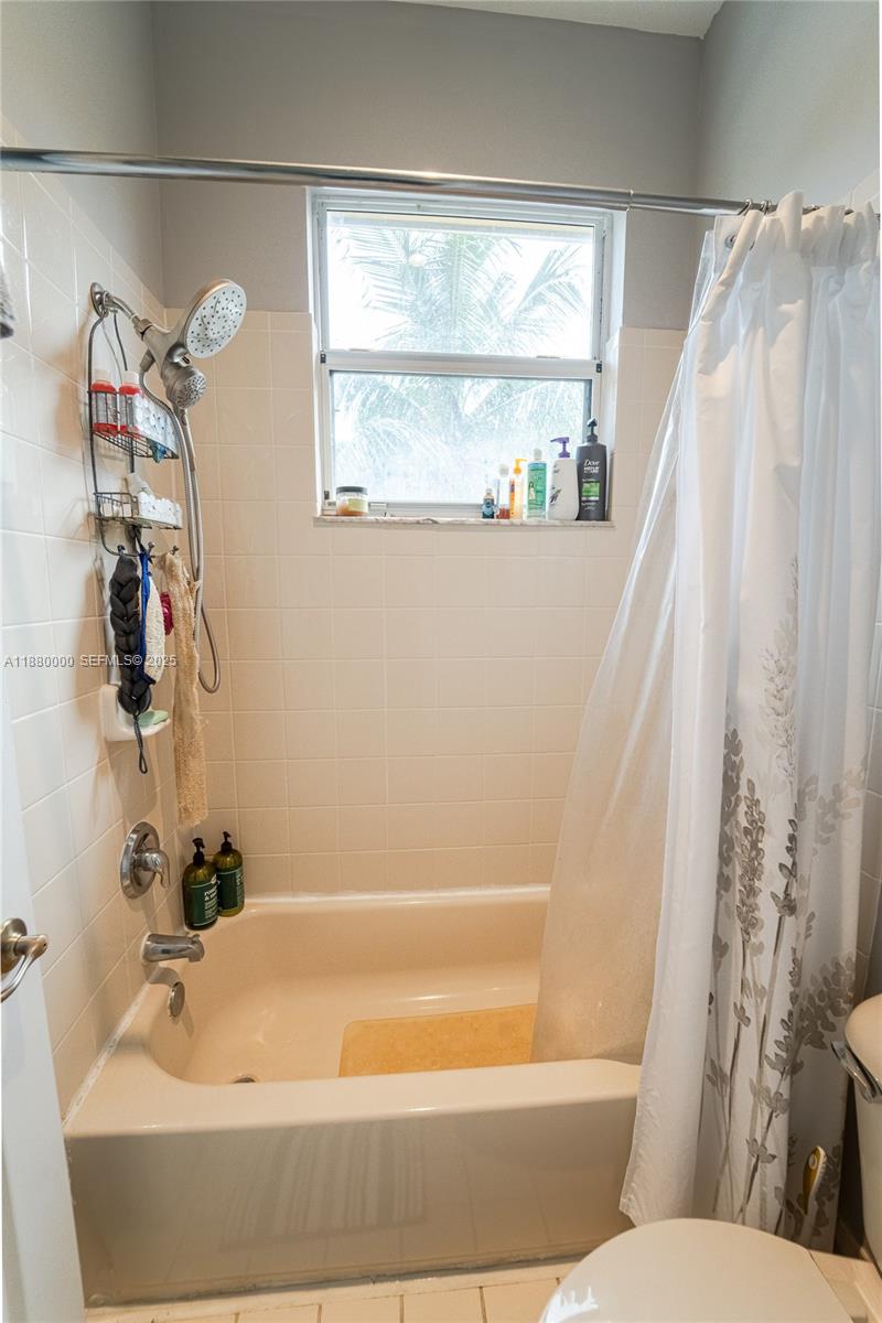 983 Northeast 42nd Place Homestead, FL 33033 - Photo 44 of 51 a bathroom with a bathtub and a shower