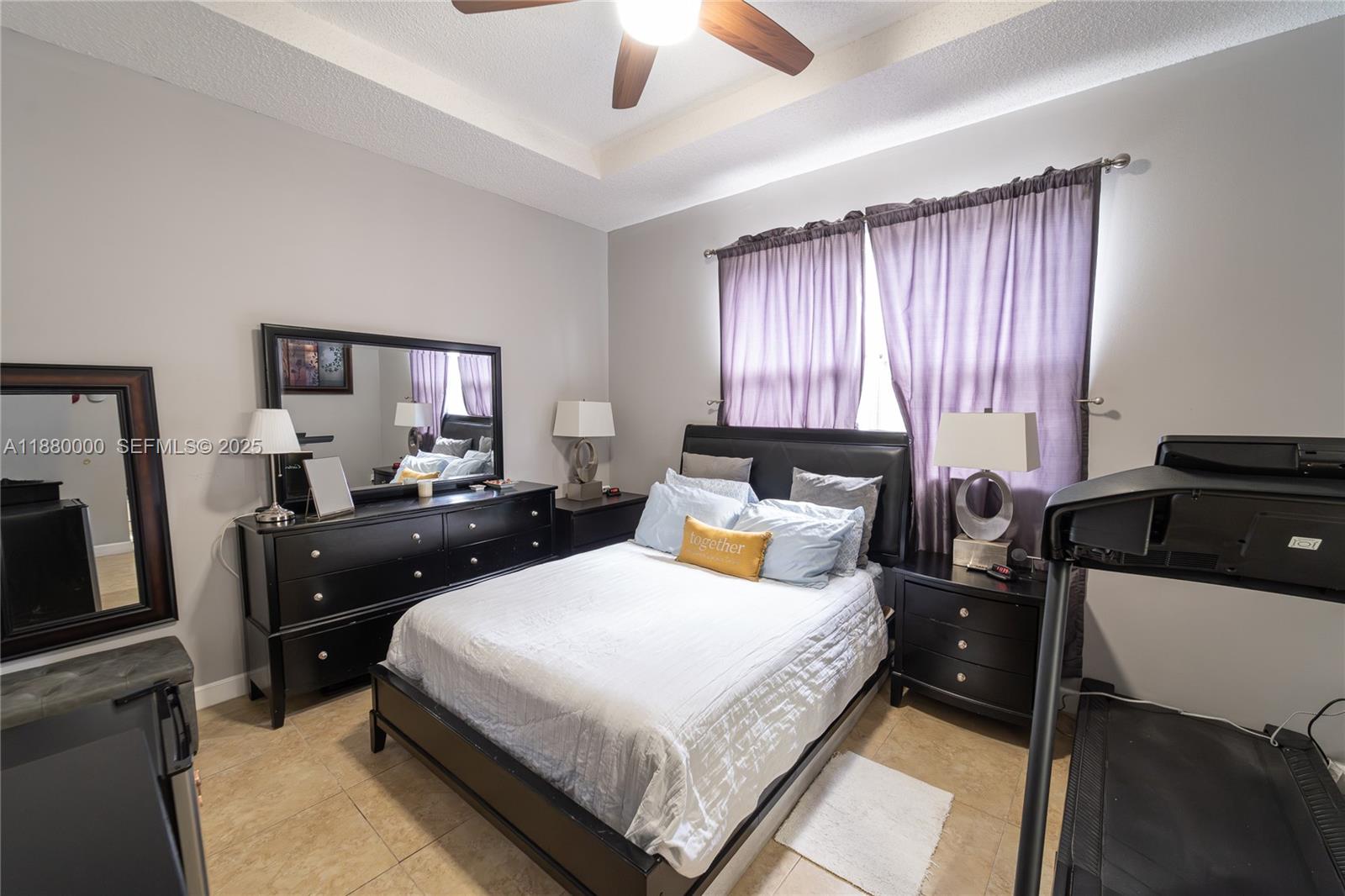 983 Northeast 42nd Place Homestead, FL 33033 - Photo 45 of 51 a bedroom with a bed and a chandelier