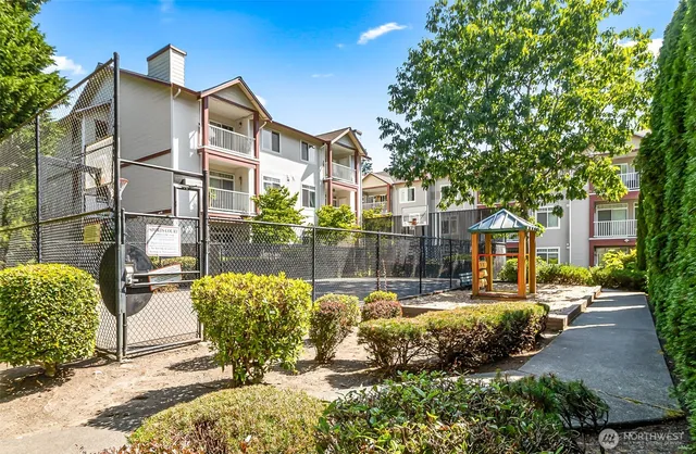 a view of a patio with table and chairs and potted plants