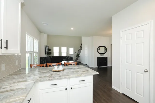 a kitchen with a stove and a microwave